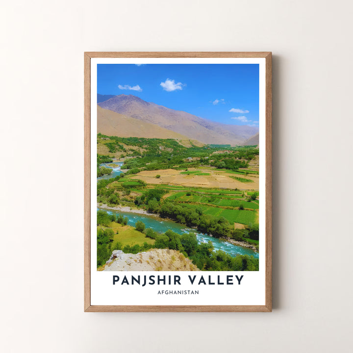 Serene landscape photograph print of Panjshir Valley, Afghanistan, highlighting the river course, green fields, and surrounding mountain elevations. Offered by MapYourDreams as an unframed art print, a gallery canvas print, or a custom framed wall art piece in retro white and silver frame choices.